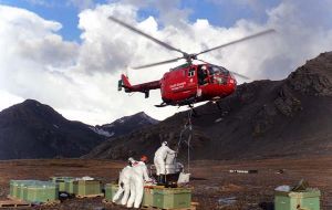 Filling the bait bucket for the helicopter. Despite several weeks of frustrating strong winds' weather  the third phase has been completed