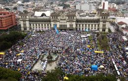Despite the rain, demonstrators in 13 cities across the Central American nation banged drums and blew whistles in the peaceful protests.