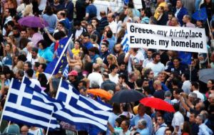 About 17,000 people gathered outside the Panathenian stadium for the “yes” rally, waving Greek and EU flags and chanting “Greece, Europe, Democracy.”