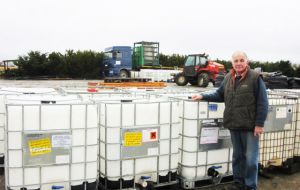 Miller at the oil yard depot and the IBC's. A four ton oil tank currently being pumped comes from the current Noble Energy Humpback exploration drill.