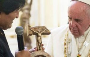 A tense moment of the tour: Bolivia's Evo Morales gifting Francis the controversial crucifix made on the hammer and sickle.