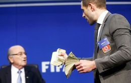 “This is for North Korea 2026,” Brodkin said as he put the bills on the desk in front of Blatter. He then tossed the notes into the air as security led him away. (Pic Reuters)