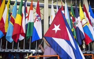 In the pre-dawn quiet, the Cuban flag was hoisted at the U.S. State Department, alongside the flags of other countries that have diplomatic relations with the US