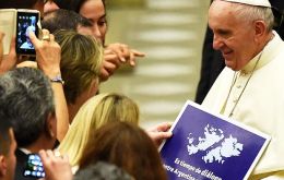 Pope's spokesman said the poster was handed during a weekly public gathering when lots of people give him things and “he had no idea what the item was”