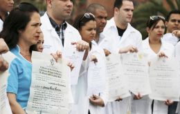 Brandishing their diplomas, the Cuban health professionals congregated in a plaza in Kennedy, a working-class neighborhood built in the 1960s 