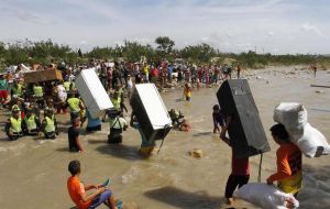 Images of Colombians wading across a border river with refrigerators, chickens and mattresses, as goats and children followed shocked many in Latin America. 