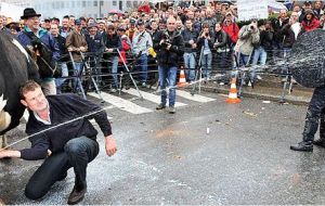 “Europe is drowning in milk,” read banners held by farmers representing the European Milk Board.