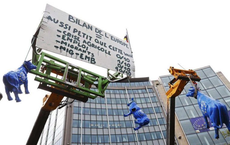 Farmers blocked streets with tractors near EU headquarters, where agriculture ministers were meeting. EC said it was “well aware of the difficult situation”