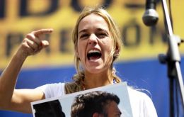 Lopez's wife Lilian Tintori gave an impassioned speech before dozens of supporters calling for people to take to the streets nationwide