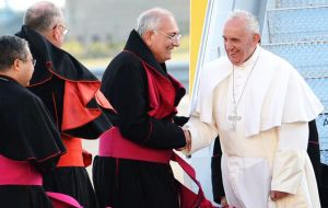 Cardinal Francis Dolan of New York greeted Francis with a hug and a kiss as he arrived onto the tarmac of Kennedy airport. 