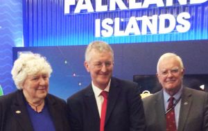 Shadow foreign secretary Hilary Benn with MLA Jan Cheek and MLA Roger Edwards at the Falklands' stand in Brighton     