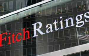 Fitch cut Brazil's rating to BBB-minus from BBB, with negative outlook on the new rating, suggesting it could downgrade Brazil to junk within the next year
