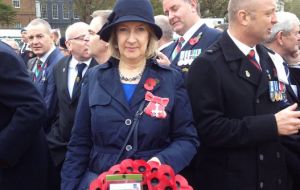 In London, Sukey Cameron, MBE waits in line to lay a Falklands' wreath at the Cenotaph with Falklands' veterans, “In gratitude & everlasting memory”