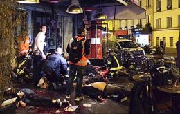 People were shot dead at bars and restaurants at five other sites in Paris. Eight attackers are reported to have been killed.