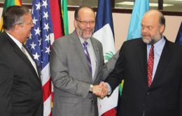 CARICOM Secretary-General Ambassador Irwin LaRocque (c) welcomes US Ambassador to CARICOM Perry Holloway to the signing ceremony, while Mission Director, USAID, Eastern and Southern Caribbean, Christo