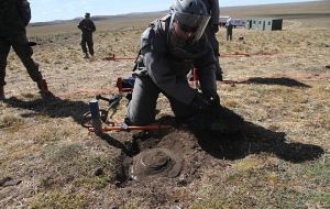 Uncovering a mine, getting it ready to be removed