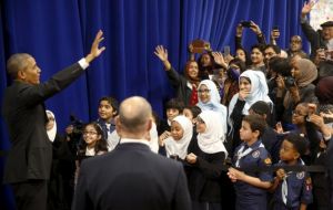 Obama urged young Muslims not to fall to choose between faith and patriotism: “You're not Muslim or American. You're Muslim and American.”