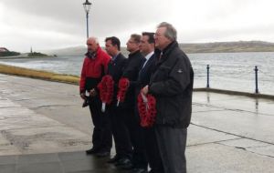 MLA Mike Summers and MPs at a wreath laying ceremony at the 1982 war memorial rather rainy ‪Falklands‬ morning  (Pic G. Short MLA)