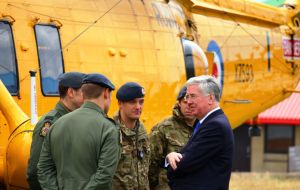 Fallon chats with members of the SAR crew, part of UK's effort in support of Falklands defense