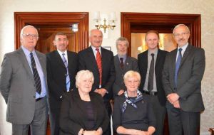 An official picture of the Falklands' elected government, MLA Rendell next to her seven peers
