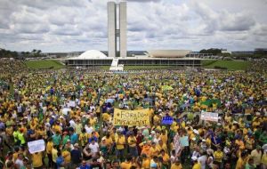 In the capital, Brasilia, protesters inflated a giant doll of Lula wearing a striped prison uniform and chained to a ball that read “Operation Carwash” 