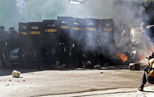 Police used tear gas to disperse hundreds of opposition protesters who clashed with Lula's supporters outside the government palace in Brasilia  