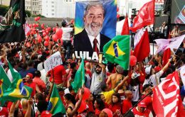 Waving the red flags of the ruling PT thousands of demonstrators took to the streets in Sao Paulo, greeting Lula with thunderous cheers 