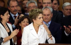 “I'm the victim of a great injustice,” Rousseff told cheering supporters. She delivered a fiery speech from a podium set up outside the Planalto palace 