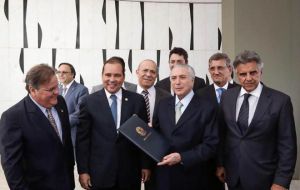 After Rousseff's suspension, Temer charged his new ministers with enacting business-friendly policies while maintaining the still-popular social programs