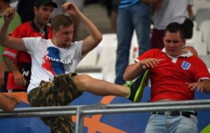 Russian fans were seen punching and kicking England fans after their 1-1 draw in the Stade Velodrome.