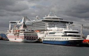 A view of the port of Ushuaia during a busy day in the midst of the cruise season with vessels docked and out in the bay   