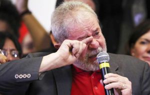 Wearing a red WP's shirt beneath a gray blazer, Lula recalled how social programs during his administration helped tens of millions of Brazilians escape poverty.