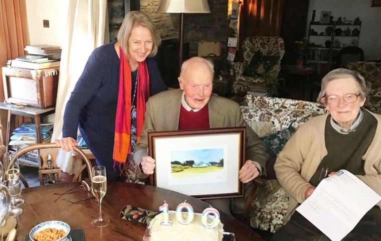 Sir Cosmo with the painting delivered by FIGO representative Sukey Cameron, MBE at his home in Ireland  
