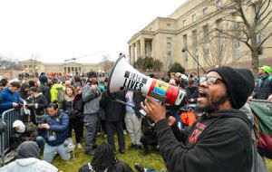 The various protest groups scattered around the city chanted anti-Trump slogans and carried signs with slogans including “Make Racists Afraid Again”