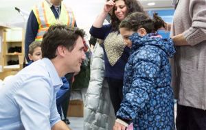Trudeau also sent a pointed tweet that showed him greeting a young refugee at a Canadian airport in 2015. 