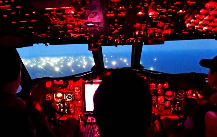 The city of floating lights as can be seen from the P-3 Orion night air patrol