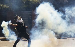 In Caracas riot police fired tear gas at protesters who threw stones, however the majority of demonstrators, who numbered in the thousands, rallied peacefully.