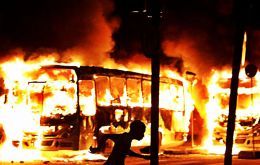 Buses and cars have been set on fire in Rio de Janeiro's city centre while roads blocks set up by activists were also ablaze and some shops were vandalized. (Pic Reuters)