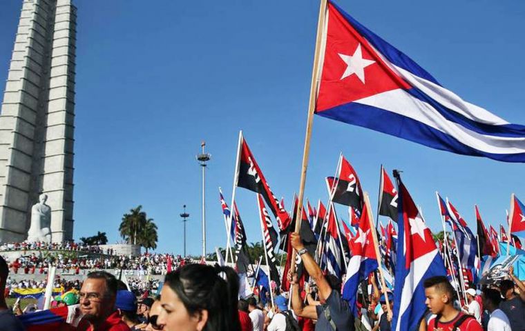  May 1 rally brings hundreds of thousands of Cubans to Havana's Revolution Square in a sea of red, white and blue flags and portraits of Fidel Castro. 