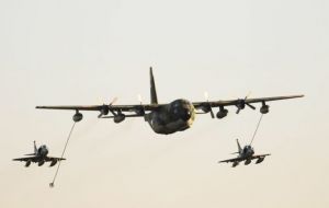 A Hercules accompanied by A-4AR fly past the base. This was followed by a parade of forces