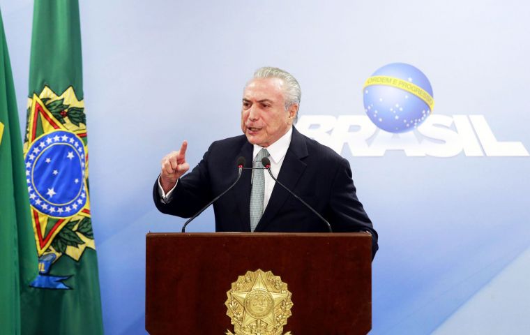 “At no time did I authorize the paying of anyone,” Temer said emphatically, raising his voice and pounding his index finger against the podium. 