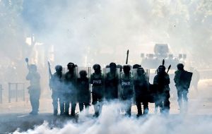 In some cities, the protests degenerated into clashes between demonstrators demanding elections to replace Maduro, and police and government troops.