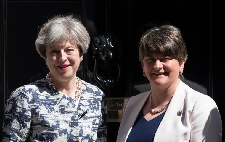 Britain's Prime Minister, Theresa May, left, greets Arlene Foster, the leader of Northern Ireland's Democratic Unionist Party at Downing Street 