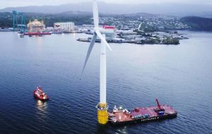 The giant is on the move, floating on a sealed vase-like tube 78 meters deep, its bottom filled with iron ore to weight the base and keep it upright in the water.