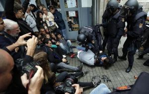 Puigdemont announced a commission to investigate Sunday's violence and legal action against national police. He also appealed for international mediation