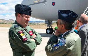 RAF pilots and crew are met by Argentine naval officers in Comodoro Rivadavia when the landing of the Voyageur carrying deep sea search equipment (Pic Infobae)