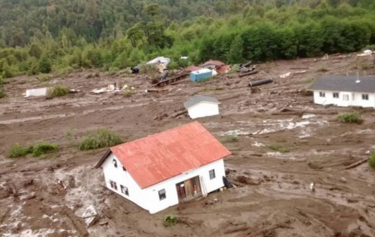 Aerial video of the devastation showed debris and portions of the village half-buried beneath the mud in the valley