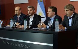 Cabinet Chief Marcos Pena, Treasury Minister Nicolas Dujovne and Central Bank Governor Federico Sturzenegger at the news conference at the Casa Rosada
