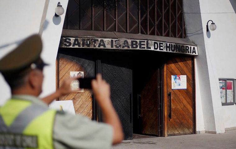 The attackers set fire to at least two of the churches in Santiago and tossed pamphlets in the street. 