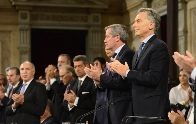 “They ask us for a shock adjustment, and to them I say we came here to reduce poverty and make sure that no Argentine goes hungry,” Macri told a full house